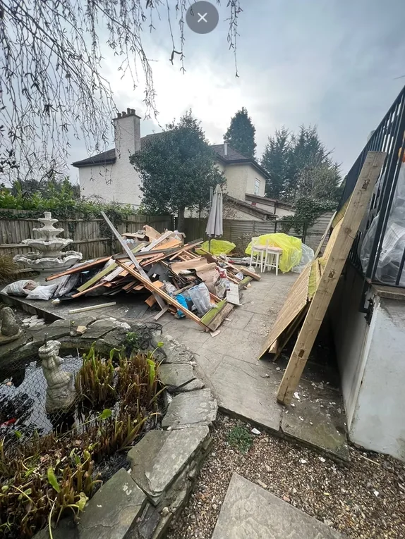 Outdoor waste and rubble before clearance
